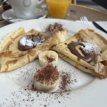 Le Bistro Marbeuf - Banana and Nutella crepes with fresh squeezed orange juice and a coffee with milk. So delicious! - French Near Me - Paris, 75 Le Bistro Marbeuf - Banana and Nutella crepes with fresh squeezed orange juice and a coffee with milk. So delicious! - French Near Me - Paris, 75