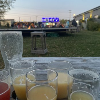 DankHouse - a row of glasses of orange juice - Breweries Near Me - Newark, Ohio