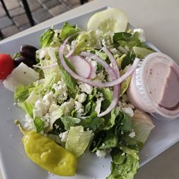 Salad with feta, olives and banana pepper