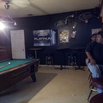 Three Roads Liquors - two men sitting at a pool table - Beer, Wine & Spirits Near Me - Brandywine, Maryland