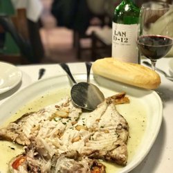 Asador Portuetxe - Besugo (Sea Bream) grilled to perfection and served with a "refrito de ajo" sauce on it.