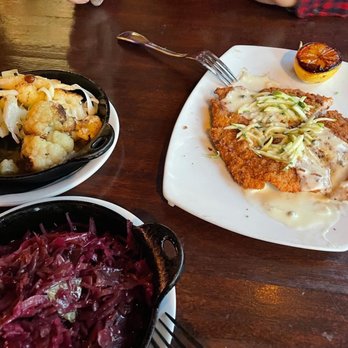 Rhein Haus - Our dinner. Lots of food so we shared. Delicious!pork Schnitzel, braised red cabbage, & cauliflower. - Bars Near Me - Denver, Colorado Rhein Haus - Our dinner. Lots of food so we shared. Delicious!pork Schnitzel, braised red cabbage, & cauliflower. - Bars Near Me - Denver, Colorado