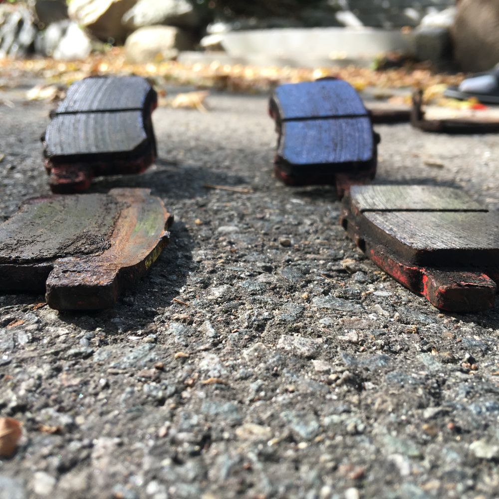 Quincy Auto Center - My rear brake pads - low angle view. Can clearly see the left brake pad is much more worn than the right. - Auto Repair Near Me - Quincy, Massachusetts Quincy Auto Center - My rear brake pads - low angle view. Can clearly see the left brake pad is much more worn than the right. - Auto Repair Near Me - Quincy, Massachusetts