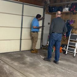Awesome Home Services - Garage Door Expert, Joe, walking his customer through his findings.