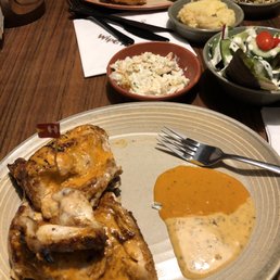 Half a chicken with sides of salad and coleslaw Half a chicken with sides of salad and coleslaw