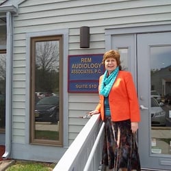 REM Audiology - Owner/Audiologist Elizabeth Patterson stading outside the Voorhees Office.