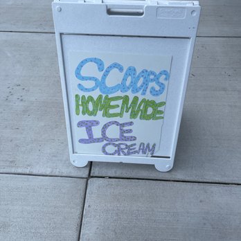 Scoops Ice Cream Parlor - a sign on the sidewalk - Ice Cream & Frozen Yogurt Near Me - Pigeon Forge, Tennessee Scoops Ice Cream Parlor - a sign on the sidewalk - Ice Cream & Frozen Yogurt Near Me - Pigeon Forge, Tennessee