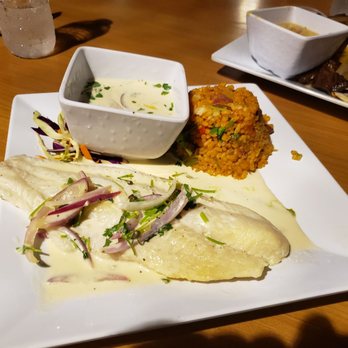 Carabalí Bar & Grill Restaurant - Grilled Lemon caper Grouper with PR rice. - Puerto Rican Near Me - Luquillo, Puerto Rico Carabalí Bar & Grill Restaurant - Grilled Lemon caper Grouper with PR rice. - Puerto Rican Near Me - Luquillo, Puerto Rico