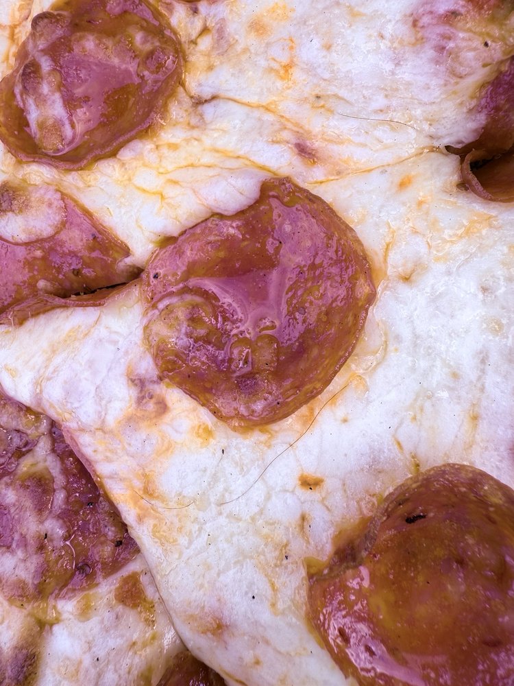 Carnesali's Pizza & Bar Logo