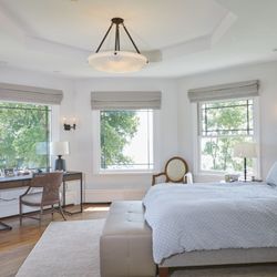 Brass Light Gallery - Elegant bedroom featuring custom Brass Light Gallery ceiling fixture and matching wall sconces in hand-finished dark bronze.