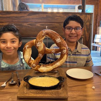 Horizon 76 - Large pretzel; soft and warm. Delish cheese dip. - New American Near Me - Keller, Texas