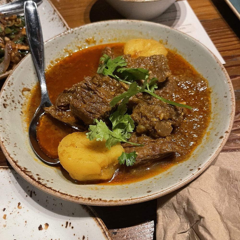 Teni East Kitchen - BEEF CURRY (GF) - Burmese Near Me - Oakland, California Teni East Kitchen - BEEF CURRY (GF) - Burmese Near Me - Oakland, California