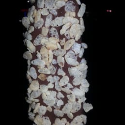 Vanilla ice cream with dark chocolate and rice crispies Vanilla ice cream with dark chocolate and rice crispies