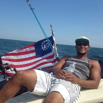 Orange Beach Sailing Charters & Sunset Cruises - My son relaxing on the boat - Boat Charters Near Me - Orange Beach, Alabama