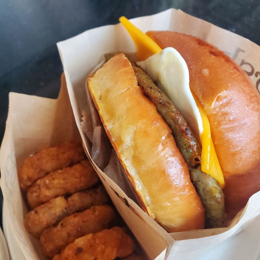 Eggslut - Chicken Sausage, Egg and Cheese Sandwich + Truffle Tots - Breakfast & Brunch Near Me - Los Angeles, California Eggslut - Chicken Sausage, Egg and Cheese Sandwich + Truffle Tots - Breakfast & Brunch Near Me - Los Angeles, California