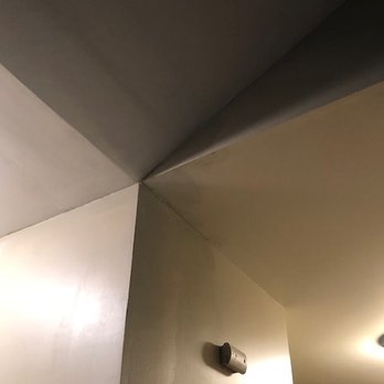 Global Roofing & Construction Services - Can clearly tell where there is new mud and paint, texture of wall doesn't blend with either adjacent wall. Ceiling has unmatched paint/mud - Roofing Near Me Global Roofing & Construction Services - Can clearly tell where there is new mud and paint, texture of wall doesn't blend with either adjacent wall. Ceiling has unmatched paint/mud - Roofing Near Me