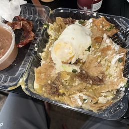 Chilaquiles verdes added bacon and egg Chilaquiles verdes added bacon and egg