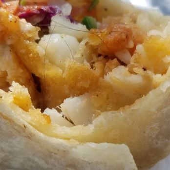Macho's Mexican Grill - a close up of a burrito - Mexican Near Me - San Diego, California Macho's Mexican Grill - a close up of a burrito - Mexican Near Me - San Diego, California