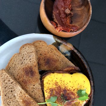 Pinch Kitchen - 1 Poached Egg in a dry potatoe basket & spec crumbled dry baconw/dry toast $10.00 - New American Near Me - Miami, Florida Pinch Kitchen - 1 Poached Egg in a dry potatoe basket & spec crumbled dry baconw/dry toast $10.00 - New American Near Me - Miami, Florida