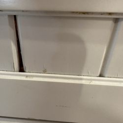 Cabinets falling apart. Can't be painted they are laminated, Color is worn off in lots of places. Cracked and split !!