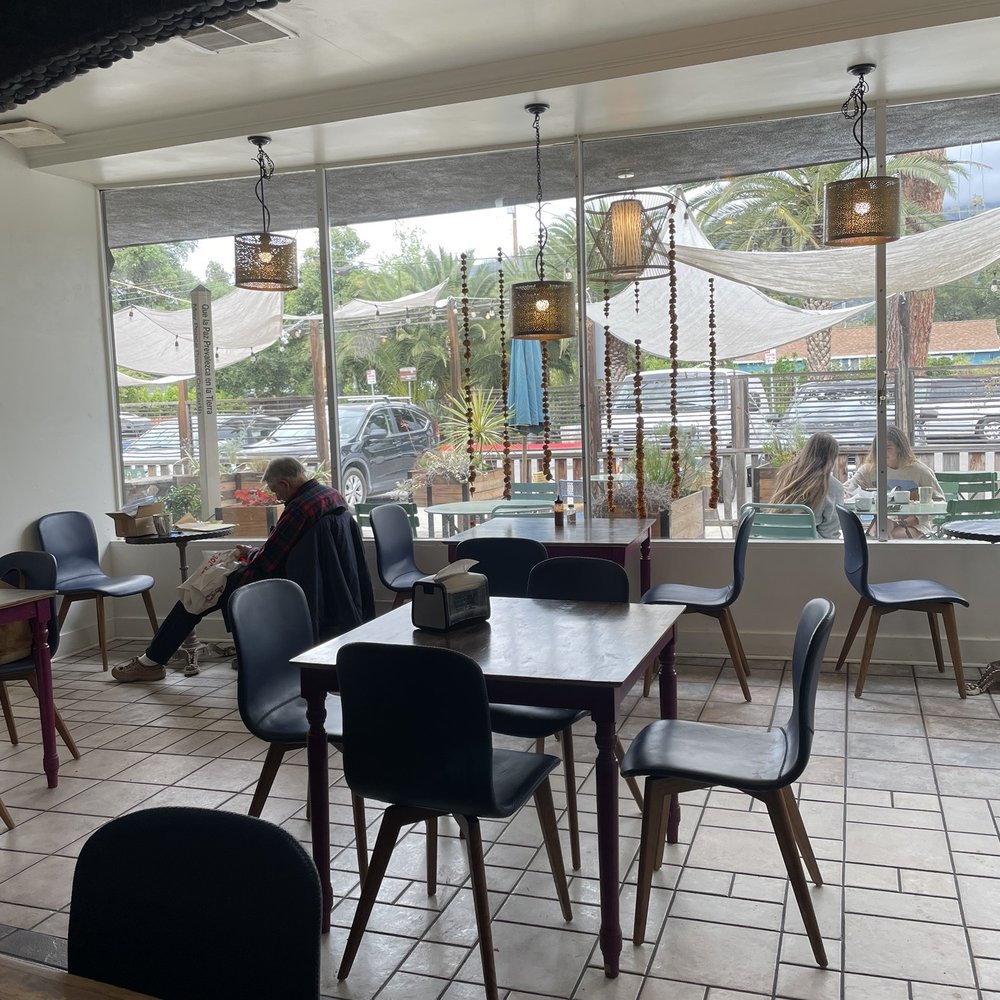 Farmer And The Cook - Indoor seating looking out to patio seating - Juice Bars & Smoothies Near Me - Ojai, California