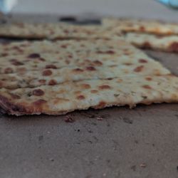 Pizza fries.   Minimal cheese on rock hard cardboard crust. $15      save your money.