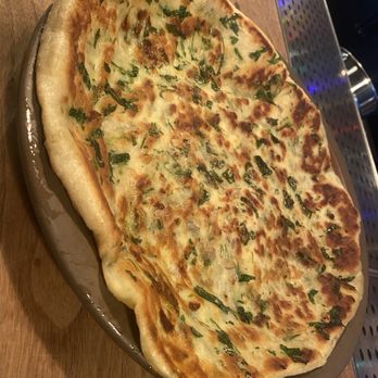 Besharam - CHEESY GARLIC NAAN pine nuts, mozzarella, sunflower seeds - Indian Near Me - San Francisco, California Besharam - CHEESY GARLIC NAAN pine nuts, mozzarella, sunflower seeds - Indian Near Me - San Francisco, California