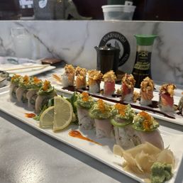 65. Hamachi (Yellowtail) w/ Miyabi topping abd 51. Christmas Roll DELICIOUS