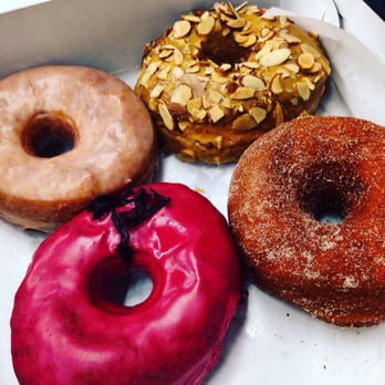 Dough - From bottom left clockwise: hibiscus, glazed, dulce de leche, cinnamon sugar - Desserts Near Me - New York, New York
