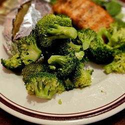 Ciao Pizza Italian Restaurant - Grilled Salmon on a bed of fresh spinach, broccoli and baked potatoe.