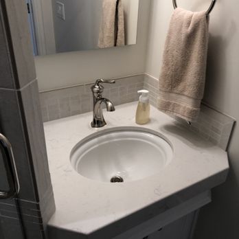 Magallanez Remodeling & Construction - a bathroom sink and mirror - General Contractors Near Me Magallanez Remodeling & Construction - a bathroom sink and mirror - General Contractors Near Me