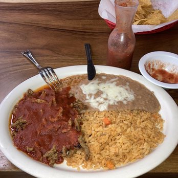 Ameca Mexican Restaurant - my meal of chile colorado (red sauce on top of skirt steak strips), refried beans, and rice - Mexican Near Me - Marianna, Arkansas