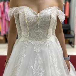 Lynn Fashion & Bridal - Original size 16 sample dress. Pinned tulle to show how the dress would look like with capped sleeves.