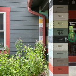 Wehrloom Honey - Side door with bee garden and bee hive pillars. So fun