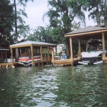 Just Docks - a row of boats docked at a dock - General Contractors Near Me - Celebration, Florida Just Docks - a row of boats docked at a dock - General Contractors Near Me - Celebration, Florida