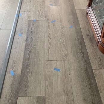 TRS Tile - All the blue tape represents where the floor is unlevel and feels soft and "bouncey" - General Contractors Near Me - Rancho Santa Margarita, California TRS Tile - All the blue tape represents where the floor is unlevel and feels soft and "bouncey" - General Contractors Near Me - Rancho Santa Margarita, California