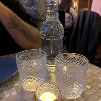 Honey Road - Pretty water bottle and glasses on the table - Middle Eastern Near Me - Burlington, Vermont