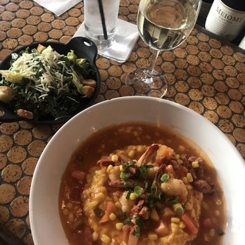 Kingfish Kitchen & Cocktails - Gulf Shrimp and Grits and side Kale Caesar Salad with a nice Pinot Grigio for brunch. - Cajun/Creole Near Me - New Orleans, Louisiana Kingfish Kitchen & Cocktails - Gulf Shrimp and Grits and side Kale Caesar Salad with a nice Pinot Grigio for brunch. - Cajun/Creole Near Me - New Orleans, Louisiana
