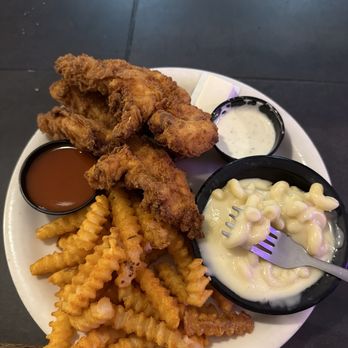 Grand River Grill - This is the chicken strip dinner but I substituted with Mac and cheese and fries.  Also came with a giant roll.  Amazing! - Steakhouses Near Me - Urich, Missouri