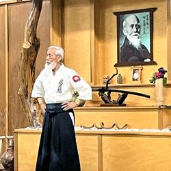 Shindai Aikikai Aikido Dojo - Saotome Sensei, founder of Aikido Schools of Ueshiba, pictures of O'Sensei and Shindai founder Dennis Hooker in background, June 2023