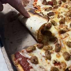 Wayno’s Hometown Pizza - 16" thin crust pizza with sausage and onion. Very undercooked and prices went up!