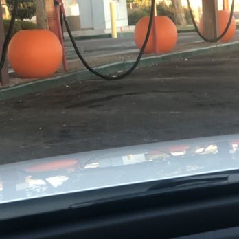 Quick Quack Car Wash - Trash all over the ground and the concrete hasn't been pressure washed in who knows how long - Car Wash Near Me - Mesa, Arizona