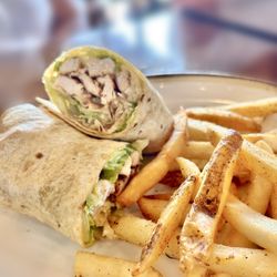Village Corner Comfort Kitchen & Bar - Chicken Caesar Wrap side Cajun Fries