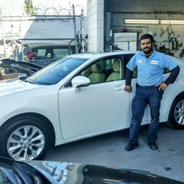 Here is the picture of Gerardo next to my wife's "as good as new" repaired Lexus as I described in my prior post!