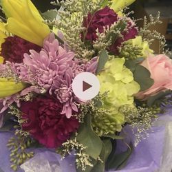 Flowers By Francis - Other side of the bouquet. Asked for tropical inspired vibrant vertical arrangement. What was delivered has nothing to do with it. 0/10