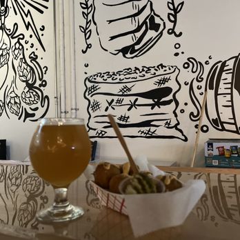 Neshaminy Creek Brewing Company - a glass of beer and a basket of food - Breweries Near Me - Croydon, Pennsylvania