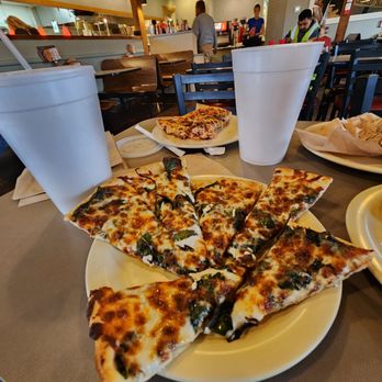 Jim's Pizza - a plate of slices of pizza on a table - Pizza Near Me - McKinney, Texas Jim's Pizza - a plate of slices of pizza on a table - Pizza Near Me - McKinney, Texas