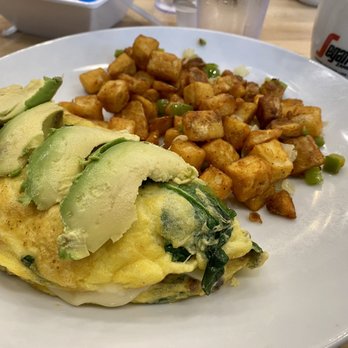 Eggsquisite Cafe - Midlothian - Bacado Bacon, spinach, tomatoes, and baby Swiss cheese. Topped with avocado. - Breakfast & Brunch Near Me - Midlothian, Texas