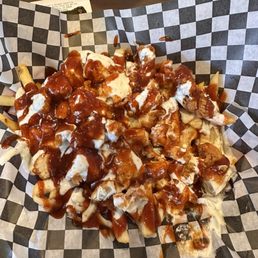 French fries covered with chicken, mozzarella, honey bbq sauce and ranch dressing French fries covered with chicken, mozzarella, honey bbq sauce and ranch dressing