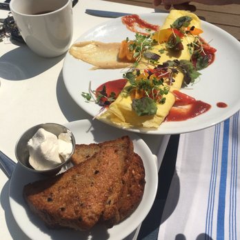 The Garden Table - Rolled omelette with wheat bread and sour cream on the side - Breakfast & Brunch Near Me - Indianapolis, Indiana The Garden Table - Rolled omelette with wheat bread and sour cream on the side - Breakfast & Brunch Near Me - Indianapolis, Indiana